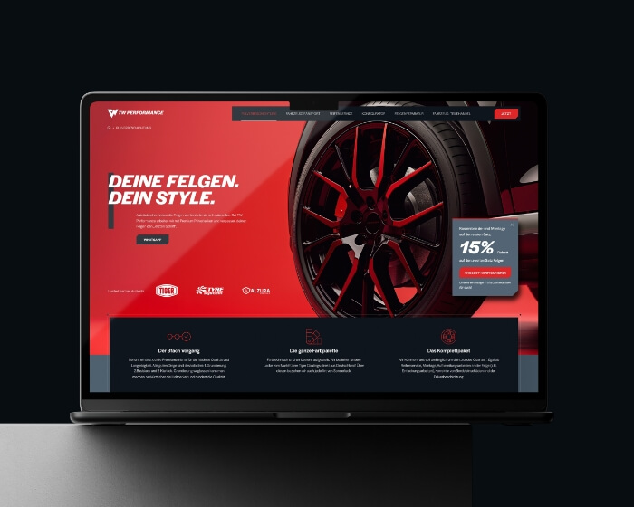 Webdesign autobedrijf TW Performance op laptop, rode velg hero met 
