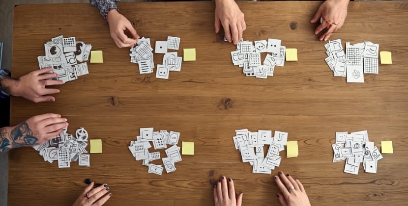 Frontend developers reviewing different CSS frameworks during a discussion