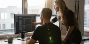 Rear view of teammate while dedicated CPU, RAM and storage are reviewed on screen