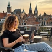 Designer reviewing an app prototype on a tablet, apps that scale