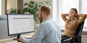 Reviewing reliable, scalable hosting status together at a bright workstation