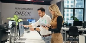 Engineers reviewing faster NVMe storage metrics on screen