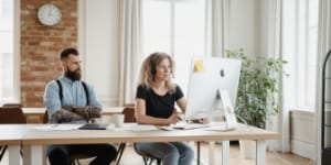 Business-hours domain support in a relaxed office with natural light.