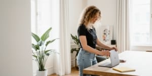 Private domain registration moment in a bright office, person shielding details.