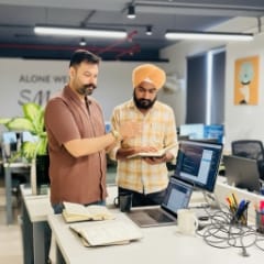 Pricing and rates, engineers reviewing notes, aligning web design pricing with scope.