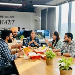 teammates at dinner, culture that supports website development cost clarity.