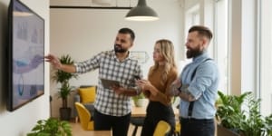 Google ads marketing agency team analyzing campaign metrics and ROAS reporting