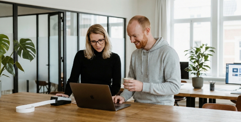 Checklist sheet on screen with privacy policy, processor list, retention rules, blurred text, tidy desk