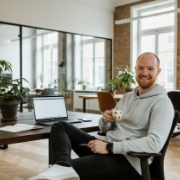 Developer relaxes with coffee at the office of a websites and apps studio in Zwolle