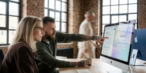 Two team members reviewing a page together at a screen, accessibility and SEO best practice