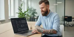 Team member at a laptop with a small padlock on the desk, CMS performance and security