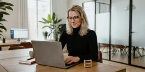 Team member building a store on a laptop, custom eCommerce platforms