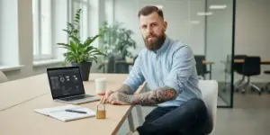 Team member at a laptop with a small padlock on the desk, eCommerce security and performance