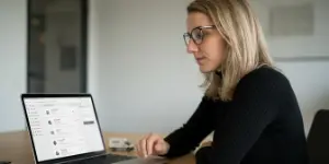 Team member working at a laptop on order flows, payment and shipping integration
