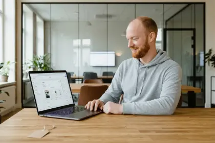 Studio Ubique team member working on a store layout on a laptop, Shopify development