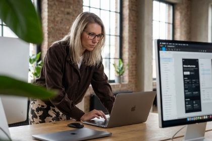 Team member focused on a laptop at a desk, Svelte and SvelteKit development
