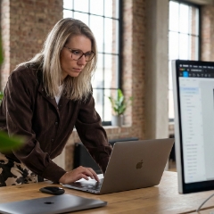 Studio Ubique designer working on a B2B web design at her desk
