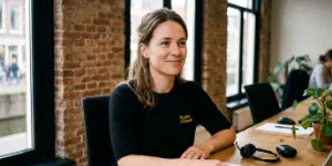 Bella, Studio Ubique's AI receptionist, at the reception desk in the Zwolle office